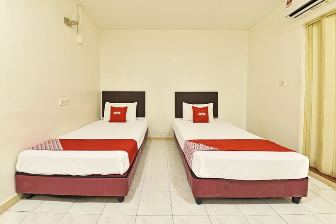 Imagen de la habitación del Hotel OYO 90806 Rumah Tumpangan Laut Selatan. Foto 7