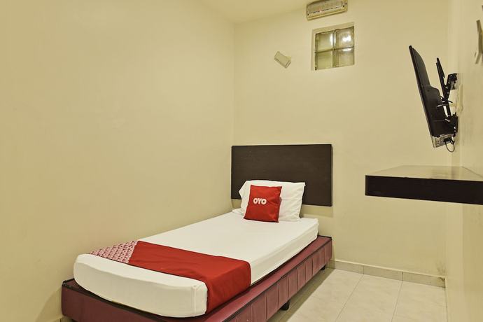 Imagen de la habitación del Hotel OYO 90806 Rumah Tumpangan Laut Selatan. Foto 9