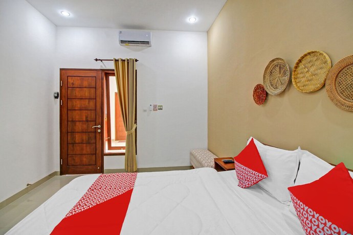 Imagen de la habitación del Hotel OYO 90820 Madania Guesthouse Syariah. Foto 9