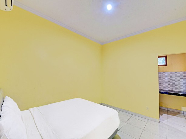 Imagen de la habitación del Hotel OYO 90823 Casa Jupiter Shine. Foto 8