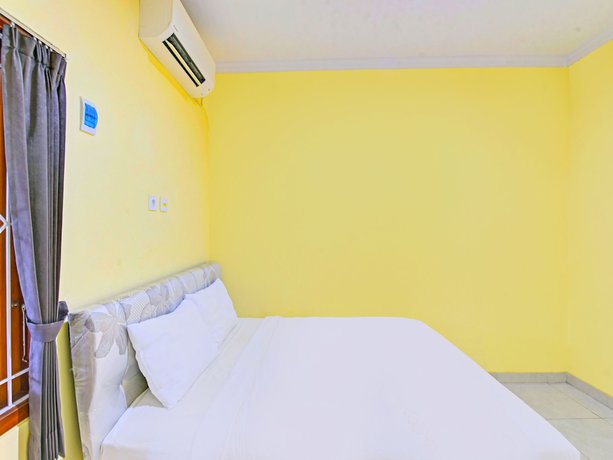 Imagen de la habitación del Hotel OYO 90823 Casa Jupiter Shine. Foto 9