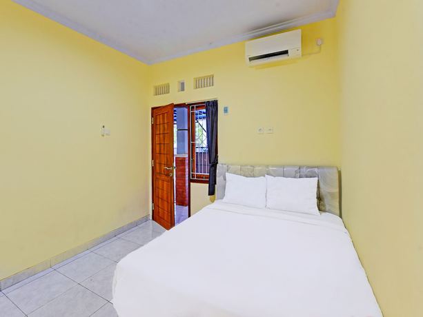 Imagen de la habitación del Hotel OYO 90823 Casa Jupiter Shine. Foto 10