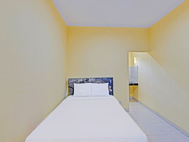 Imagen de la habitación del Hotel OYO 90823 Casa Jupiter Shine. Foto 11