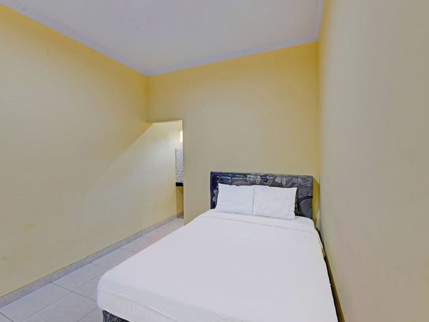 Imagen de la habitación del Hotel OYO 90823 Casa Jupiter Shine. Foto 14