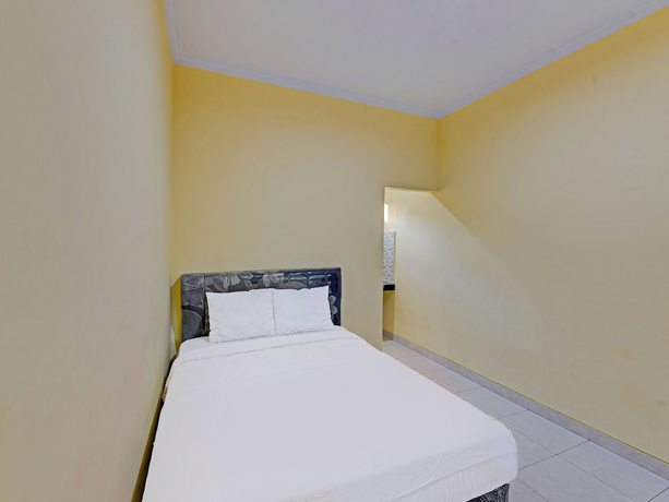 Imagen de la habitación del Hotel OYO 90823 Casa Jupiter Shine. Foto 15