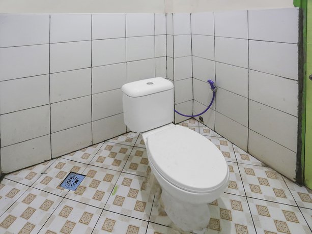 Imagen de la habitación del Hotel OYO 90825 Lizha 2. Foto 9