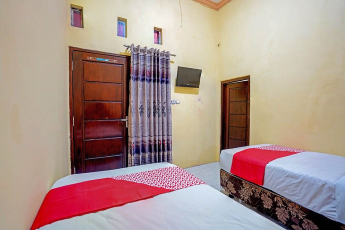 Imagen de la habitación del Hotel OYO 90829 Sahara Homestay Syariah. Foto 3