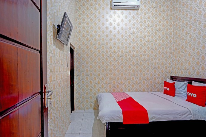 Imagen de la habitación del Hotel OYO 90829 Sahara Homestay Syariah. Foto 8