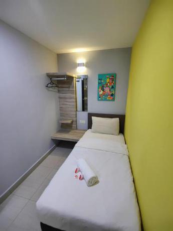 Imagen de la habitación del Hotel OYO 90848 Link Suite. Foto 18