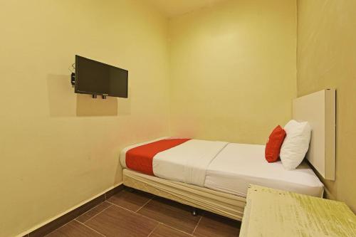 Imagen de la habitación del Hotel OYO 90853 New Soho. Foto 18