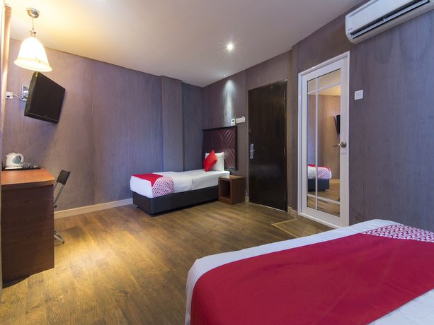 Imagen de la habitación del Hotel OYO 90894 Smc I-city. Foto 4