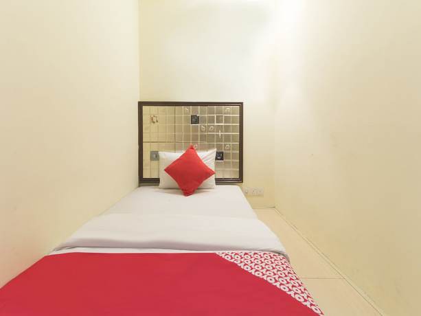 Imagen de la habitación del Hotel OYO 90894 Smc I-city. Foto 15