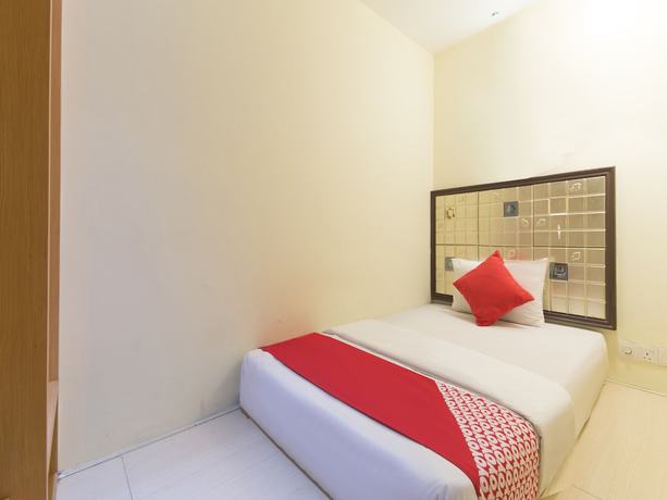Imagen de la habitación del Hotel OYO 90894 Smc I-city. Foto 17