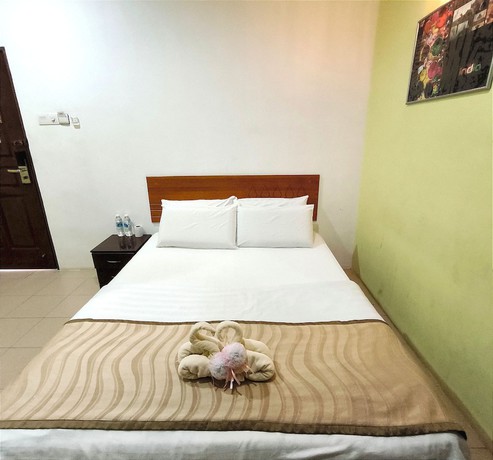 Imagen de la habitación del Hotel OYO 90906 Rumah Rehat Awana. Foto 4