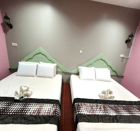 Imagen de la habitación del Hotel OYO 90906 Rumah Rehat Awana. Foto 9