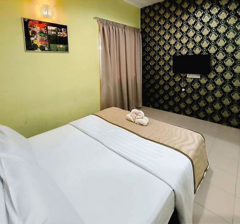 Imagen de la habitación del Hotel OYO 90906 Rumah Rehat Awana. Foto 14