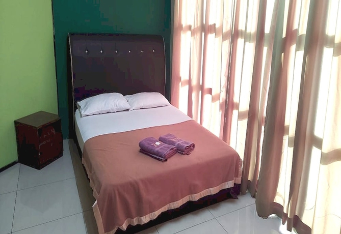 Imagen de la habitación del Hotel OYO 90937 Tanjak. Foto 4