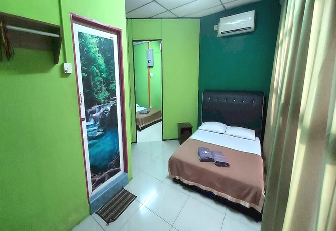 Imagen de la habitación del Hotel OYO 90937 Tanjak. Foto 5