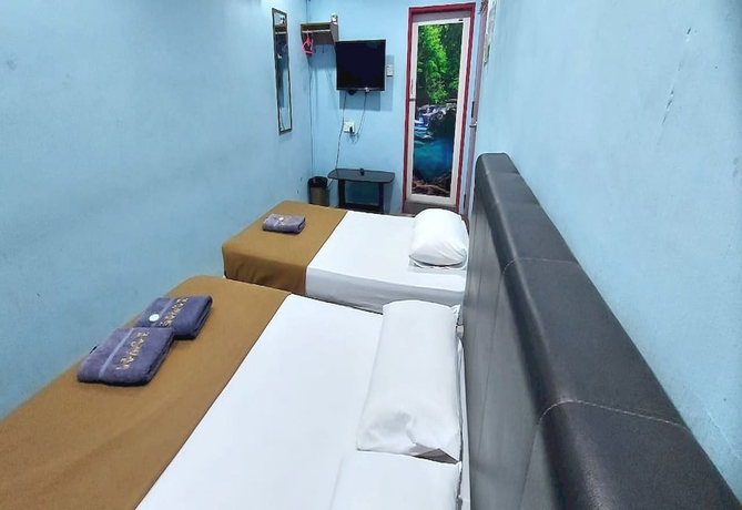 Imagen de la habitación del Hotel OYO 90937 Tanjak. Foto 6