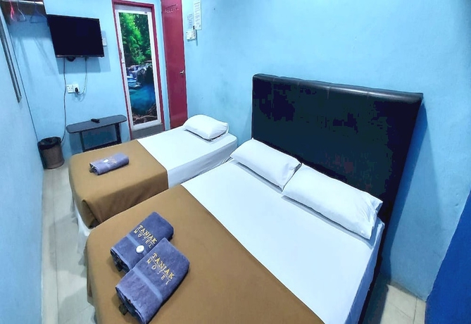 Imagen de la habitación del Hotel OYO 90937 Tanjak. Foto 7