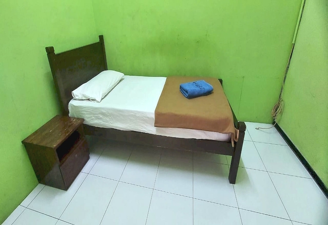 Imagen de la habitación del Hotel OYO 90937 Tanjak. Foto 10