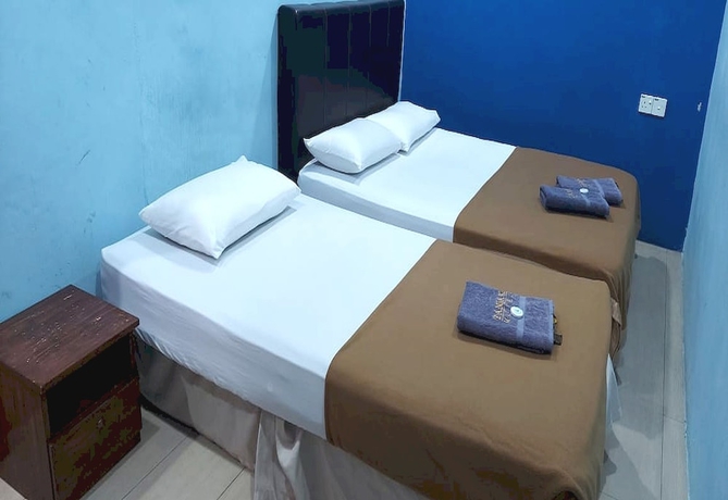 Imagen de la habitación del Hotel OYO 90937 Tanjak. Foto 12