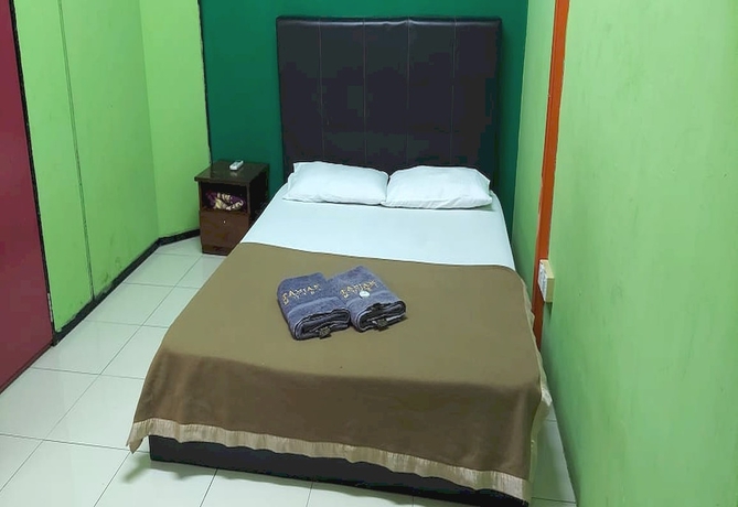 Imagen de la habitación del Hotel OYO 90937 Tanjak. Foto 15