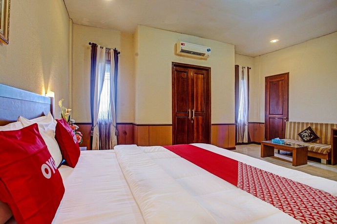 Imagen de la habitación del Hotel OYO 90947 Sarbini. Foto 2