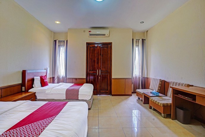 Imagen de la habitación del Hotel OYO 90947 Sarbini. Foto 4