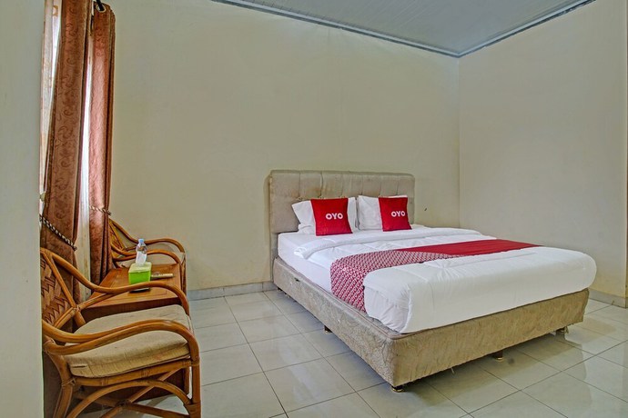 Imagen de la habitación del Hotel OYO 90947 Sarbini. Foto 7