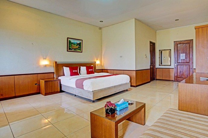 Imagen de la habitación del Hotel OYO 90947 Sarbini. Foto 11
