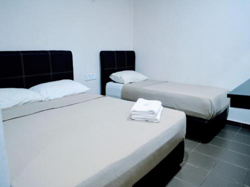 Imagen de la habitación del Hotel OYO 90963 Gest Inn. Foto 17
