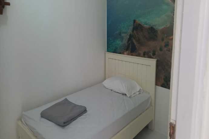 Imagen de la habitación del Hotel OYO 90974 Homestay Golo Koe Sejahtera. Foto 10