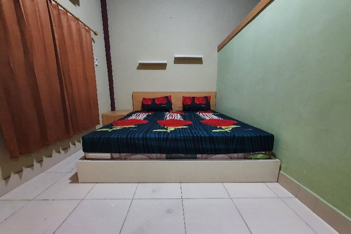 Imagen de la habitación del Hotel OYO 90976 Bagus Family Syariah. Foto 8