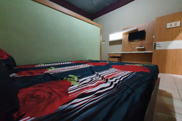 Imagen de la habitación del Hotel OYO 90976 Bagus Family Syariah. Foto 9