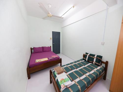 Imagen de la habitación del Hotel OYO 91004 Homestay Masjid At Taqwa (Syariah). Foto 17