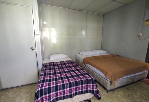 Imagen de la habitación del Hotel OYO 91020 59. Foto 19