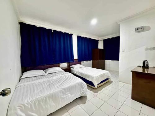 Imagen general del Hotel OYO 91033 Vaigan. Foto 12