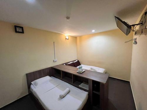 Imagen de la habitación del Hotel OYO 91040 Ezi Inn. Foto 19