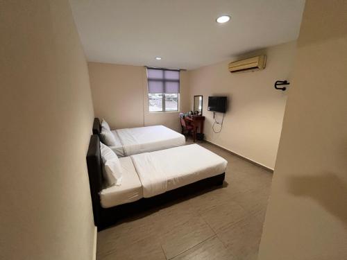 Imagen general del Hotel OYO 91044 Tampoi Sojourn. Foto 17