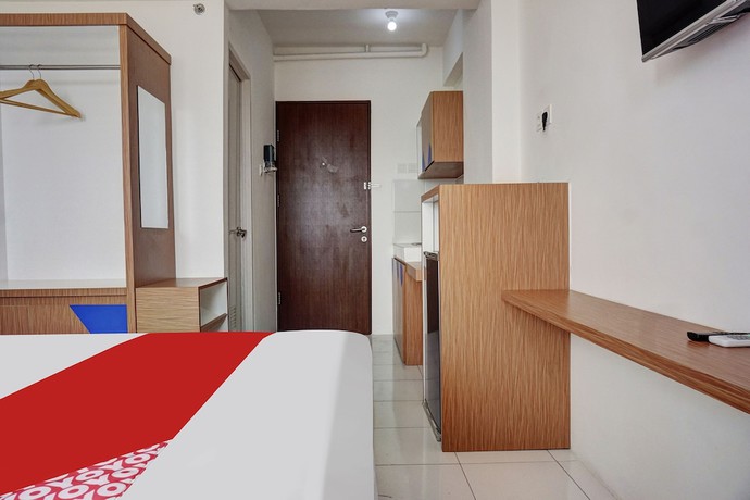 Imagen de la habitación del Hotel OYO 91045 Tower Mahakam By Toha Room. Foto 4