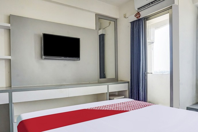 Imagen de la habitación del Hotel OYO 91045 Tower Mahakam By Toha Room. Foto 8