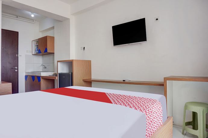 Imagen de la habitación del Hotel OYO 91045 Tower Mahakam By Toha Room. Foto 9