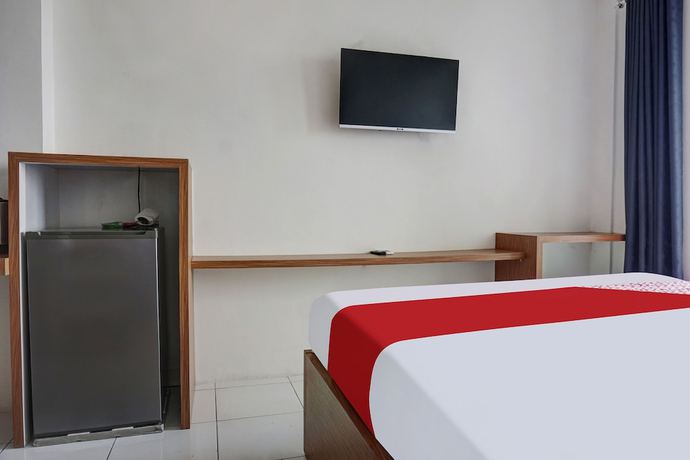 Imagen de la habitación del Hotel OYO 91045 Tower Mahakam By Toha Room. Foto 11