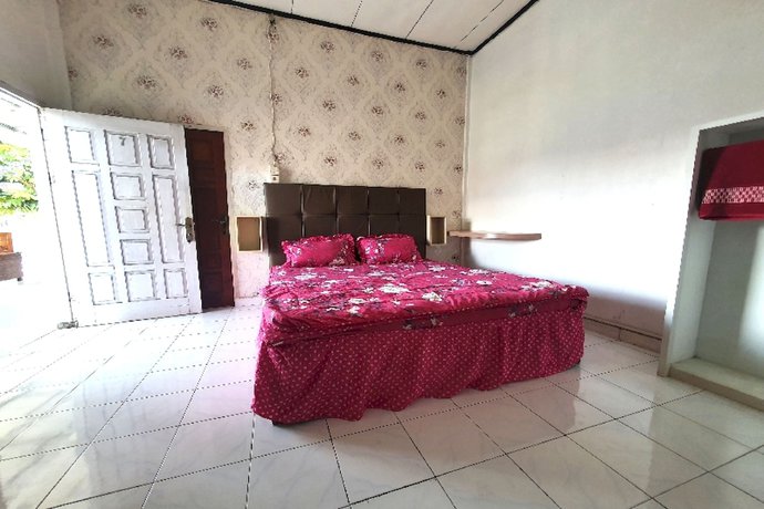 Imagen de la habitación del Hotel OYO 91077 Losmen Bunda Arema. Foto 5