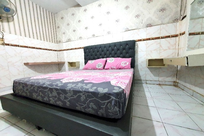 Imagen de la habitación del Hotel OYO 91077 Losmen Bunda Arema. Foto 6