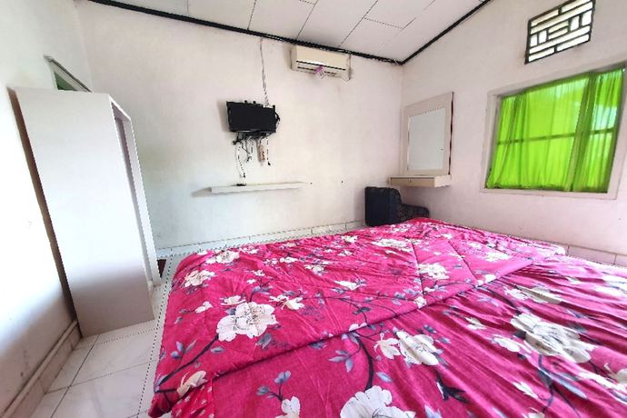 Imagen de la habitación del Hotel OYO 91077 Losmen Bunda Arema. Foto 7