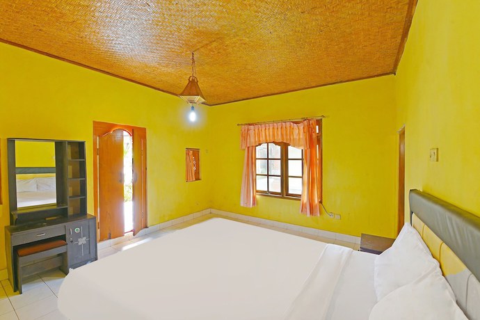 Imagen de la habitación del Hotel OYO 91100 Pondok Kusuma Wisata. Foto 6
