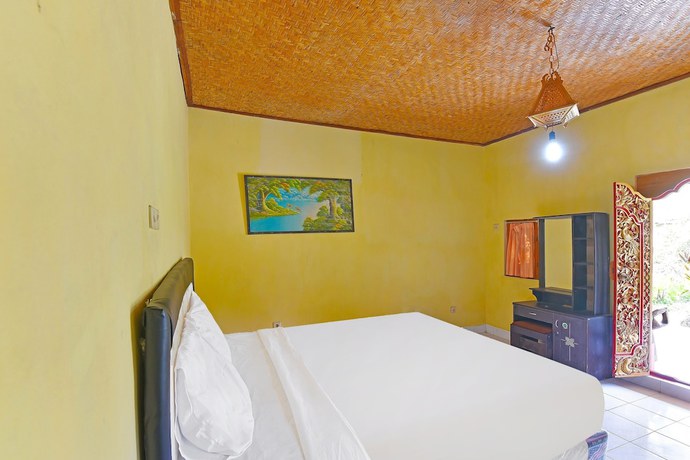 Imagen de la habitación del Hotel OYO 91100 Pondok Kusuma Wisata. Foto 8