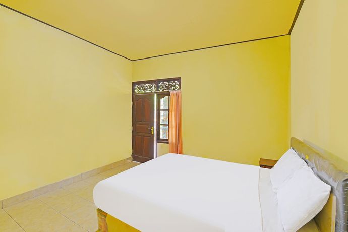 Imagen de la habitación del Hotel OYO 91100 Pondok Kusuma Wisata. Foto 13